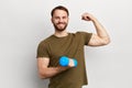 Satisfied young strong man lifting dumbbell isolated on white background Royalty Free Stock Photo