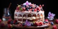 Chocolate cake covered with berries and sugar icing