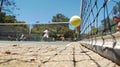 The satisfying moment when a players powerful volley hits the ground on their opponents side captured in a closeup shot