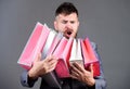Satisfying shopping tour. Exclusive commercial offer. Man bearded businessman customer carry many shopping bags. Enjoy
