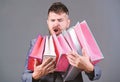 Satisfying shopping tour. Exclusive commercial offer. Man bearded businessman customer carry many shopping bags. Enjoy