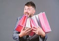 Satisfying shopping tour. Man bearded businessman customer carry many shopping bags. Enjoy shopping profitable deals