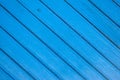 Saturated blue wooden planking background with cracks Royalty Free Stock Photo