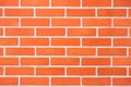 Saturated bright modern orange brick wall background