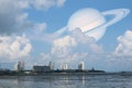 Saturn back cloud sky on sea and city ,concept Saturn near Earth