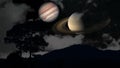 Saturn and Jupiter rise back silhouette mountain and cloud on the night sky Royalty Free Stock Photo