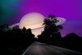 Saturn near earth on night sky over the country road