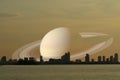 Saturn on night sky back silhouette city on sunset