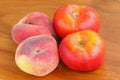 Saturn Peaches and Flat Nectarines on a wooden background Royalty Free Stock Photo