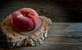 Saturn peaches on wooden table. Royalty Free Stock Photo