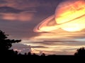 saturn space in sunset sky and silhouette tree Royalty Free Stock Photo