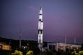 Saturn V NASA rocket against a sunset sky at the space and rocket center in Huntsville, Alabama