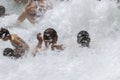 People bathing in natural spa of the hot Mill waterfalls of cascate dele Mulino. Grosseto, Tuscany,