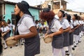 Women members of the cultural event Encontro de Chegancas, in Saubara Bahia, parade through the streets of the city dancing and