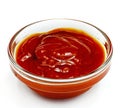 Sauce in a glass container on the white background