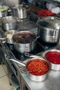 Sauce pans at restaurant kitchen
