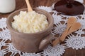 Saucepan with milk rice porridge and butter Royalty Free Stock Photo