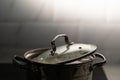 A saucepan on the stove in the kitchen. Boiling bubbling water while cooking.