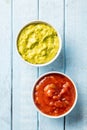 Sauces in bowl. Guacamole and tomato dip