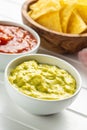 Sauces in bowl. Guacamole and tomato dip