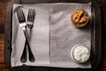 Sauces in plates and forks on an empty paper-lined tray. Serving start. Place for text Royalty Free Stock Photo