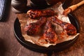 Saucy Barbecued Chicken Drumsticks on Iron Pan Royalty Free Stock Photo