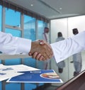 Saudi Arab businessmen shaking hands, and making agreement or a