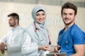 Saudi arab doctors working with a tablet. Royalty Free Stock Photo