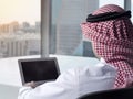 Saudi Arab Man Watching Laptop at Work Contemplating