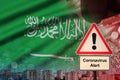 Saudi Arabia flag and Coronavirus 2019-nCoV alert sign. Concept of high probability of novel coronavirus outbreak through Royalty Free Stock Photo