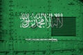 Saudi Arabia flag depicted on side part of military armored tank closeup. Army forces conceptual background