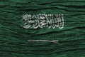 Saudi Arabia flag with high detail of old wooden background Royalty Free Stock Photo