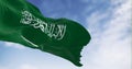 Saudi Arabia national flag waving in the wind on a clear day