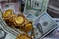 Saudi Arabia Riyals and USA USD American dollars banknotes currency bills money with sovereign British gold coins shapes bullion Royalty Free Stock Photo