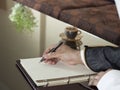 Saudi Arabian Man Hand Writing on A Notebook