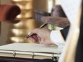 Saudi Arabian Man Hand Writing on A Notebook