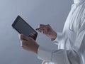 Saudi Arabian Man Hands Holding Tablet