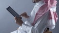 Saudi Arabian Man Hands Holding Tablet