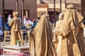 Saudi arabians dressed in golden ritual clothes in ceremony of the camel cup race performance, Al Ula, Saudi Arabia