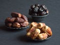 Saudi dates fruits are laid out on a dark table. Royalty Free Stock Photo