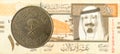 100 saudi riyal coin against 10 saudi riyal bank note Royalty Free Stock Photo