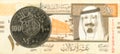 100 saudi riyal coin against 10 saudi riyal bank note Royalty Free Stock Photo