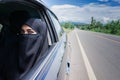 Saudi Woman Driving a Car on the road.