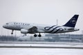 Saudia Sky Team plane taking off from airport, snow on runway