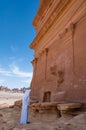 Saudian outside a Nabatean tomb in MadaÃÂ®n Saleh archeological s