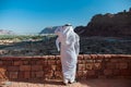 Saudian overlooking the old city of Al Ula, Saudi Arabia