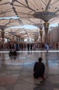 Saudian sitting on the floor in Al-Masjid an-NabawÃÂ«, Saudi Arab