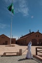 Saudian walking away with Saudian Flag, Saudi Arabia Royalty Free Stock Photo