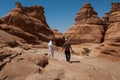 Saudian walking on top of rock formations, Saudi Arabia Royalty Free Stock Photo