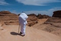 Saudian walking on top of rock formations, Saudi Arabia Royalty Free Stock Photo